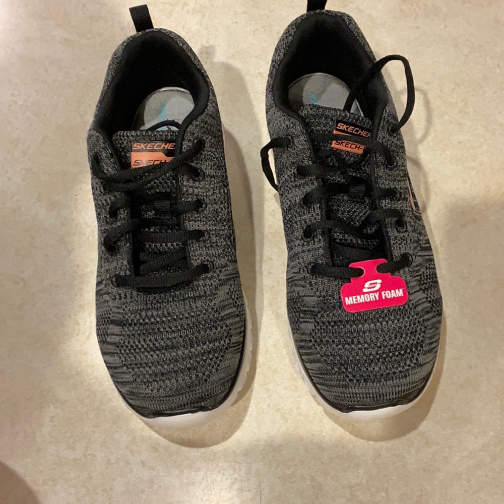Skechers ladies size 9, BRAND NEW - NEVER WORN.  TAG ON.  Memory foam sneakers.